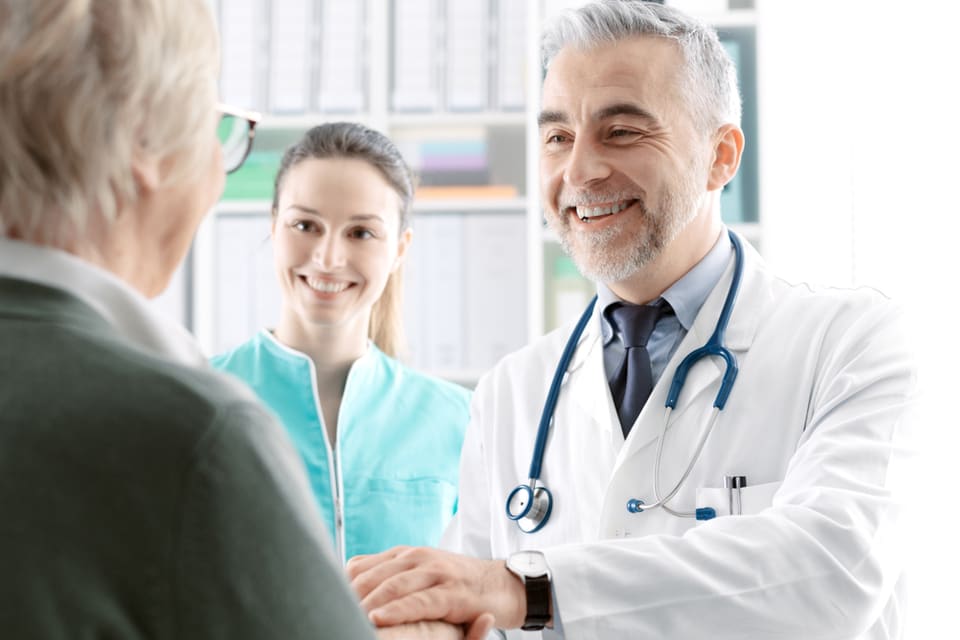 Geriatrician meeting with a senior.