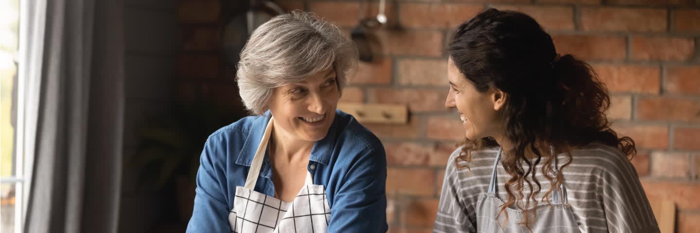 Senior and daughter in kitchen