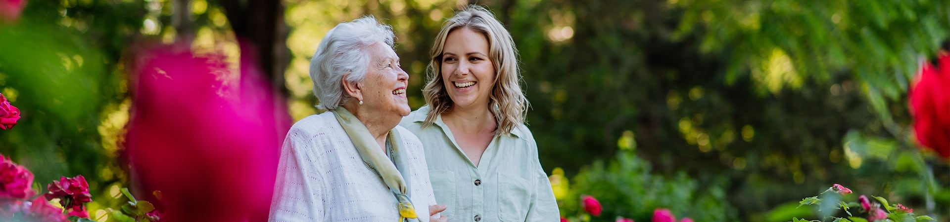 Mother and daughter smiling